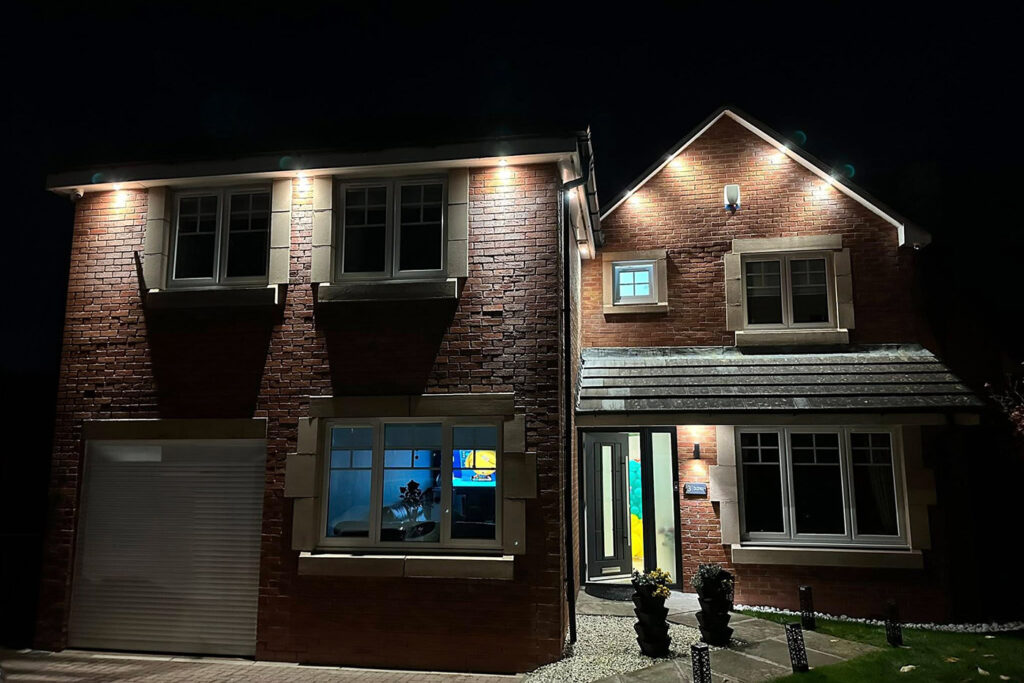 Illuminated brick house at night